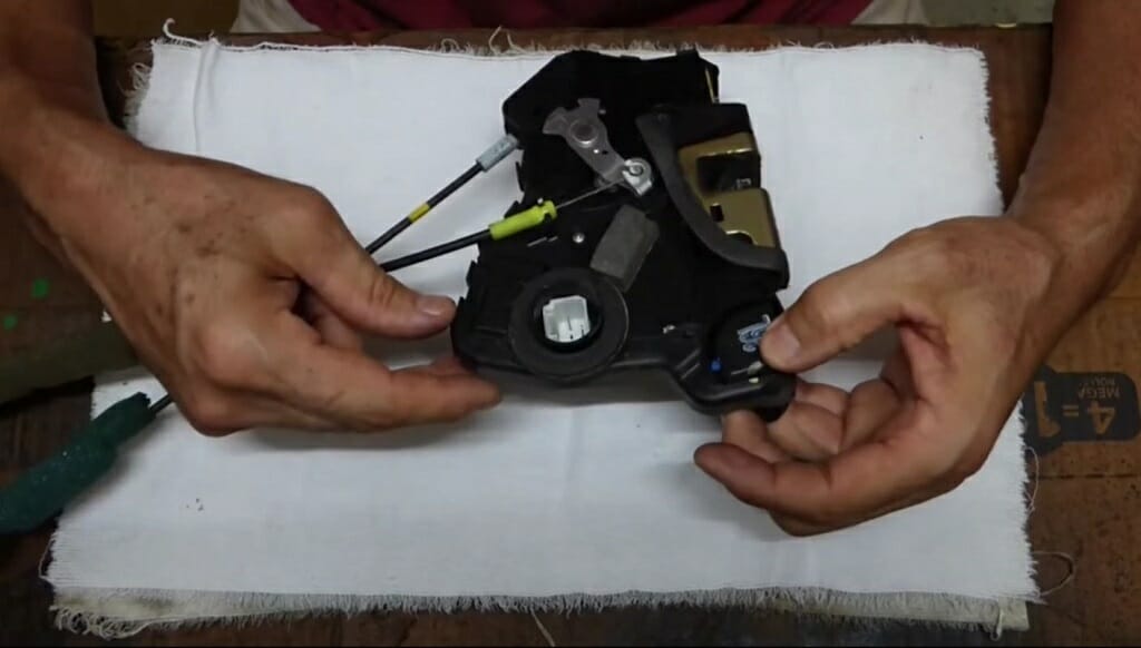 man examining the actuator