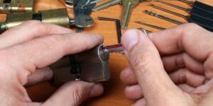 man holding a cylindrical lockset