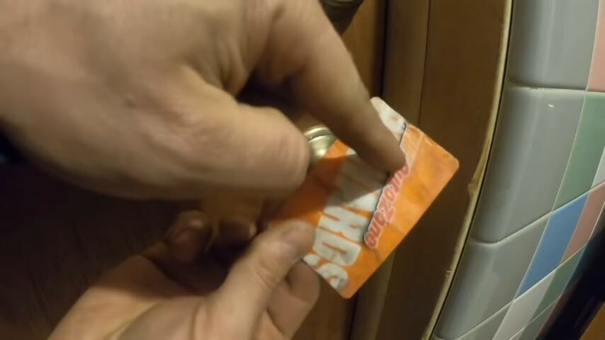 man holding a plastic card