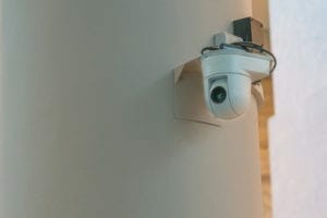 Modern CCTV camera on the wall concept or surveillance and monitoring Modern CCTV camera on the wall concept or surveillance and monitoring