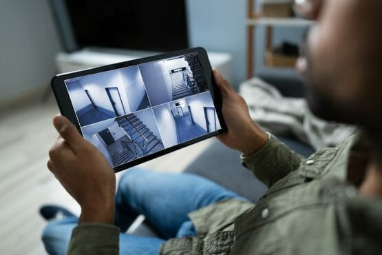 Person Monitoring Cameras Live View Of Home On The Digital Tablet Person Monitoring Cameras Live View Of Home On The Digital Tablet