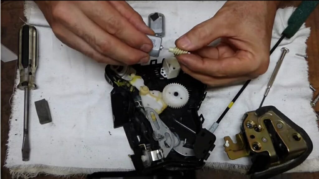 man reassembling the actuator