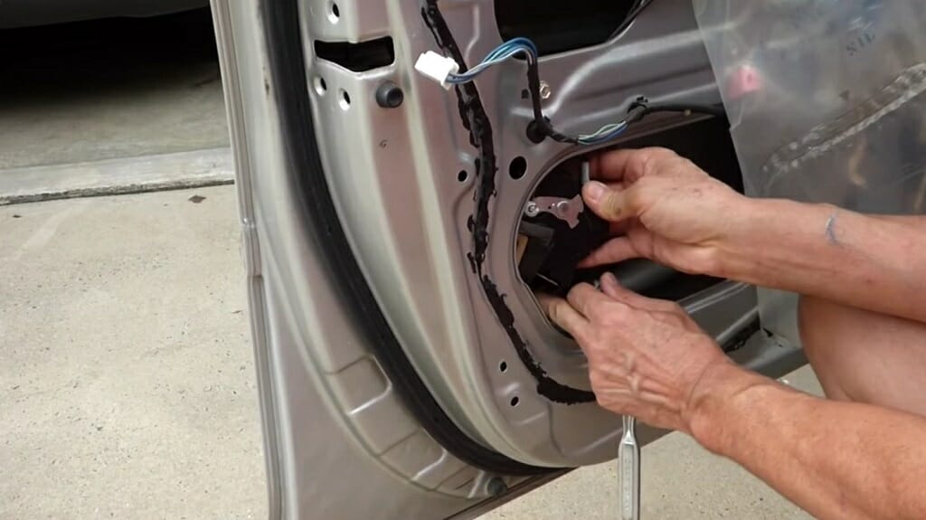 man taking out the car actuator