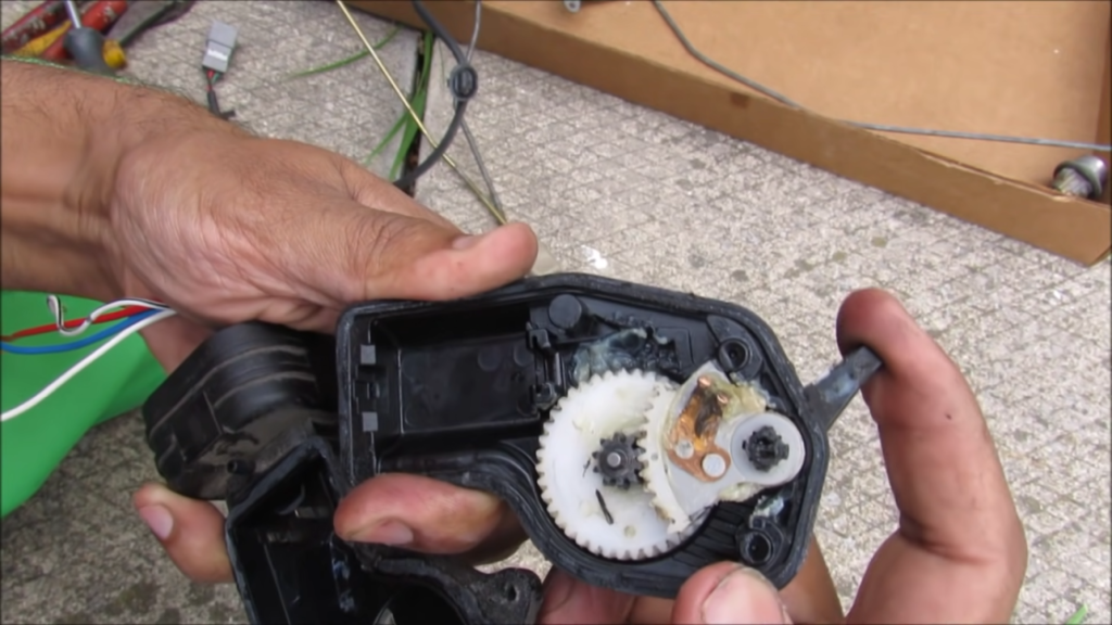mechanic inspecting the car door lock