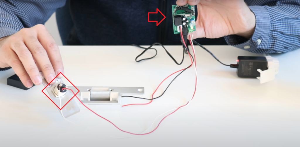 man dismantling electronic key lock