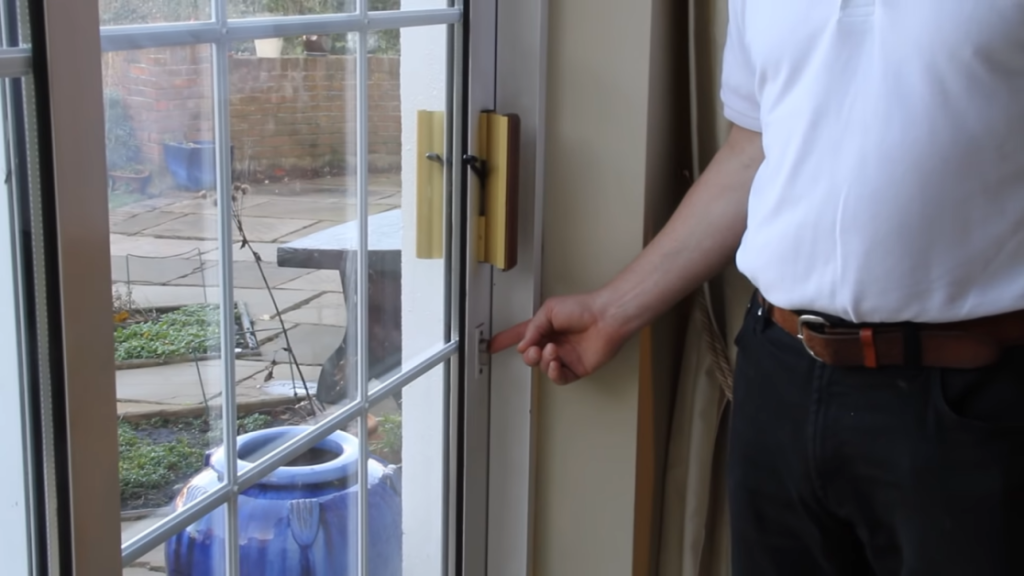 man opening the patio door